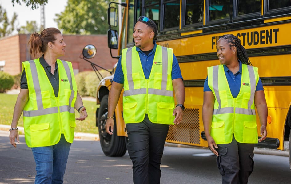 firs-student-team-walking-by-bus-happy